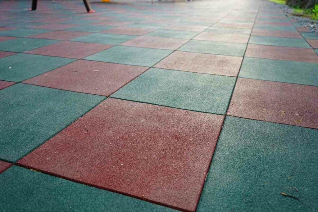 Kid friendly rubber surface backyard idea