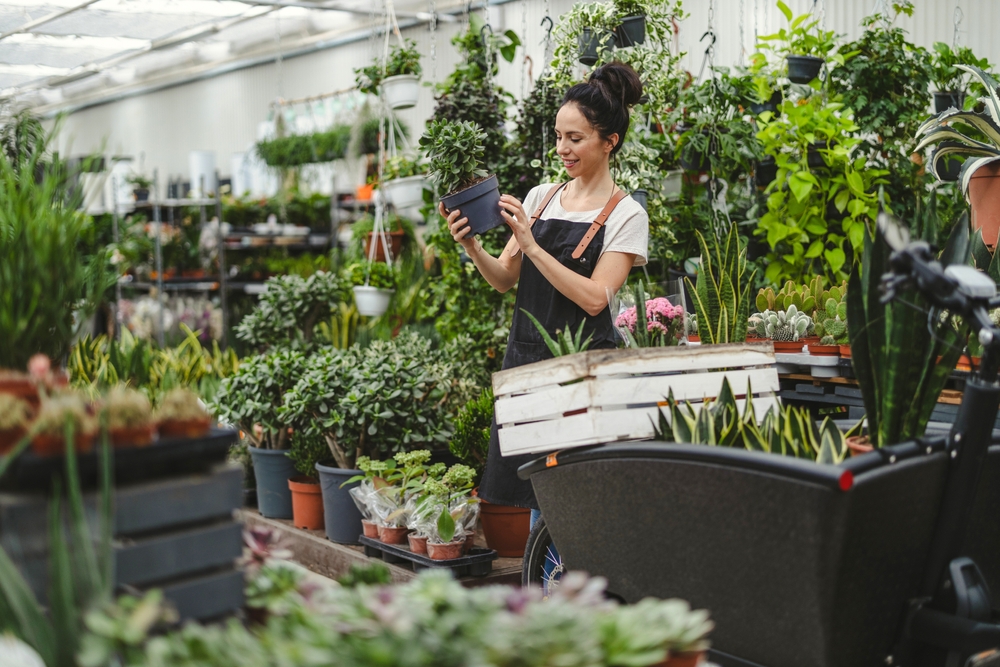 A woman working in a garden center.